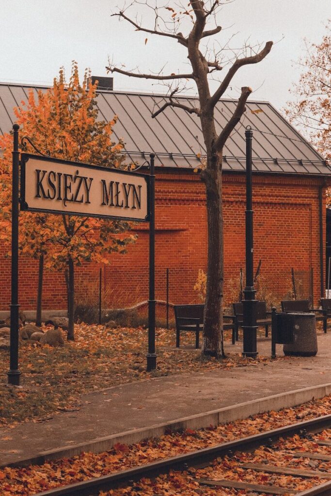 a sign in front of a brick building