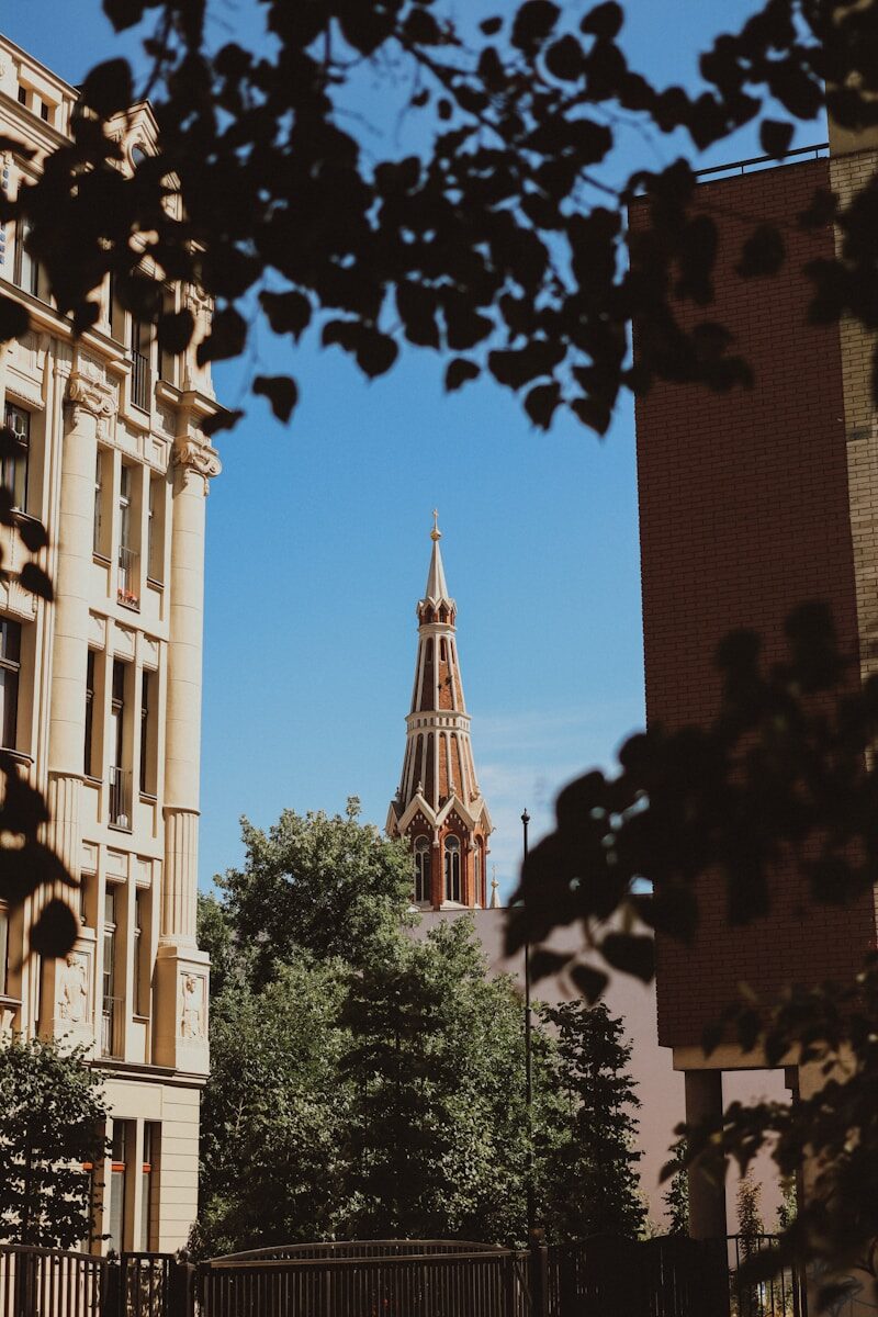 a tall clock tower towering over a city