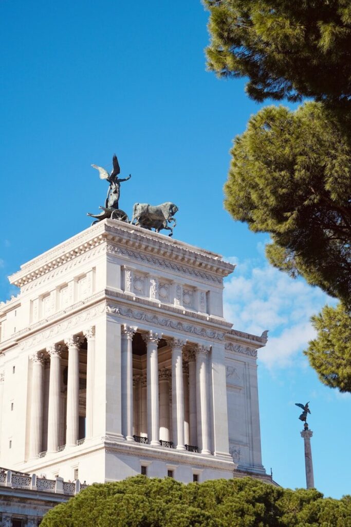 a statue of a man on a horse on top of a building