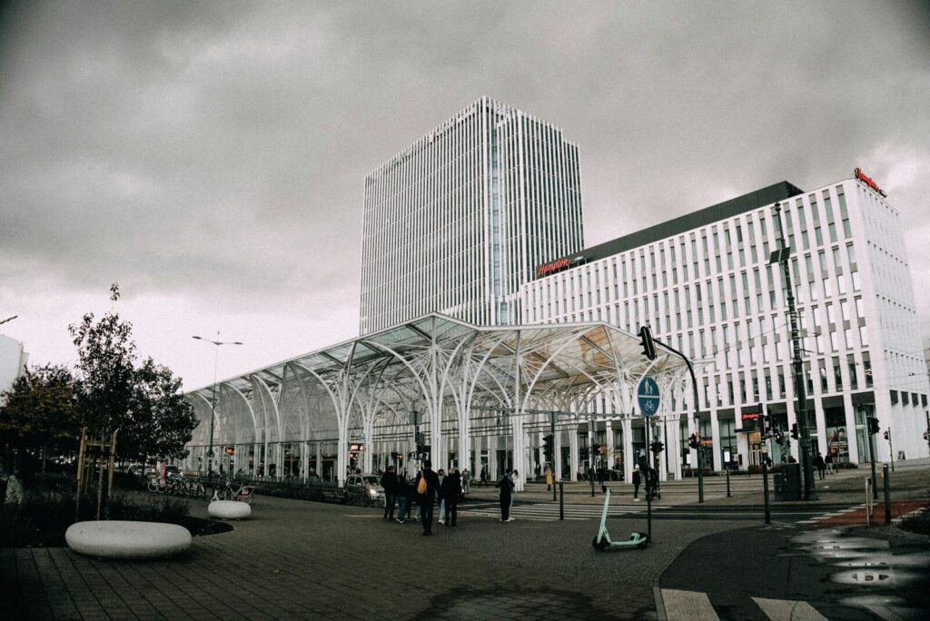 Modern buildings with a covered walkway and people